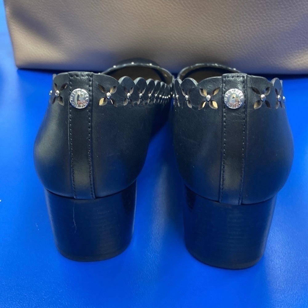 Michael Michael Kors Thalia studded round toe stacked heel. Scalloped design.